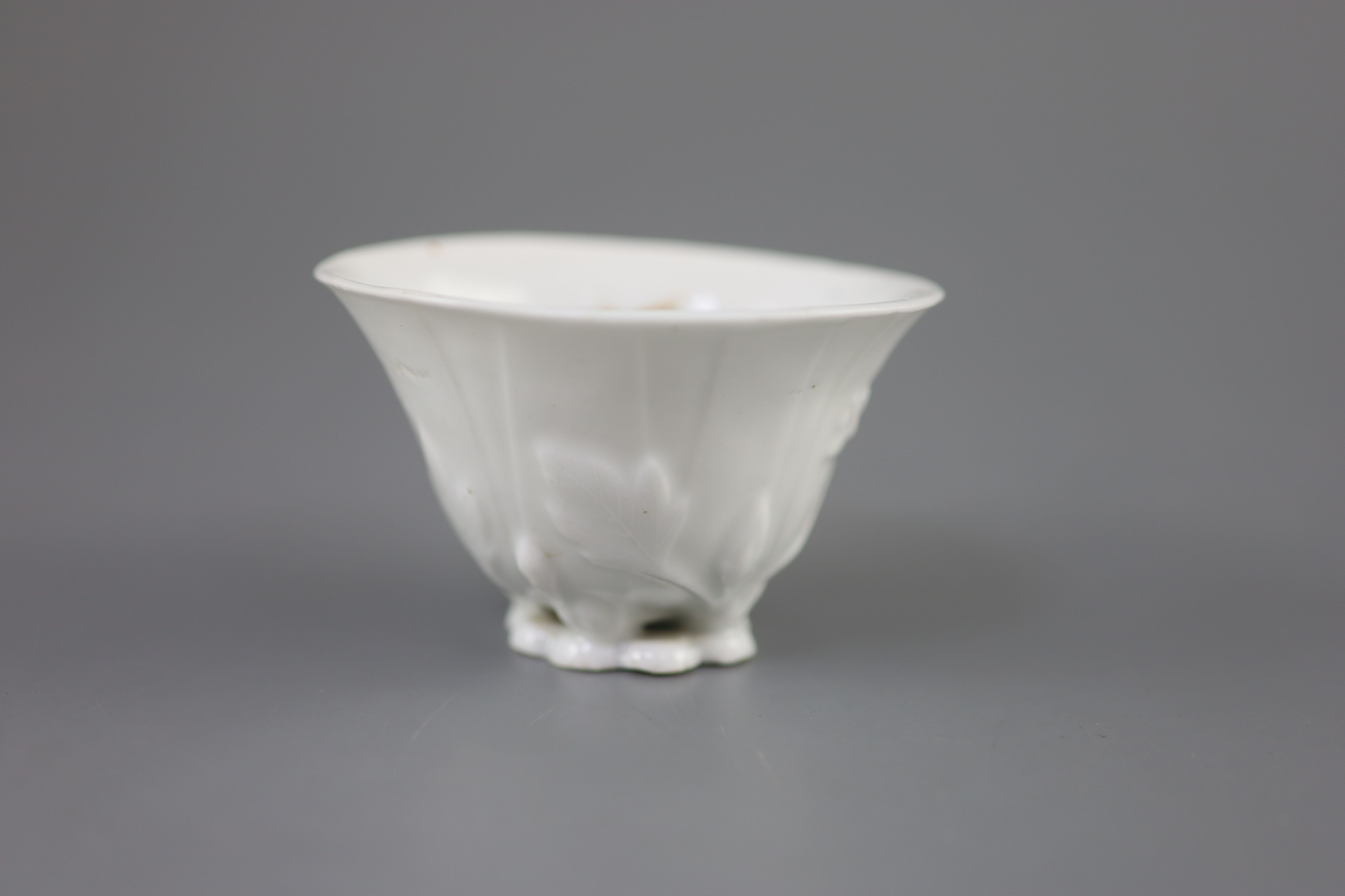 A Chinese Dehua blanc de chine libation cup, 5.3cm high